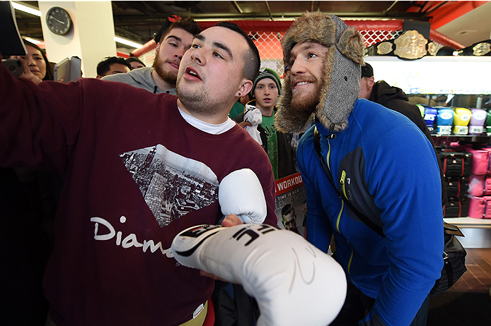BOSTON, MA - JANUARY 15: UFC featherweight Conor McGregor of Ireland poses with fans after an open training session at UFC Gym on January 15, 2015 in Boston, Massachusetts. (Photo by Jeff Bottari/Zuffa LLC/Zuffa LLC via Getty Images)