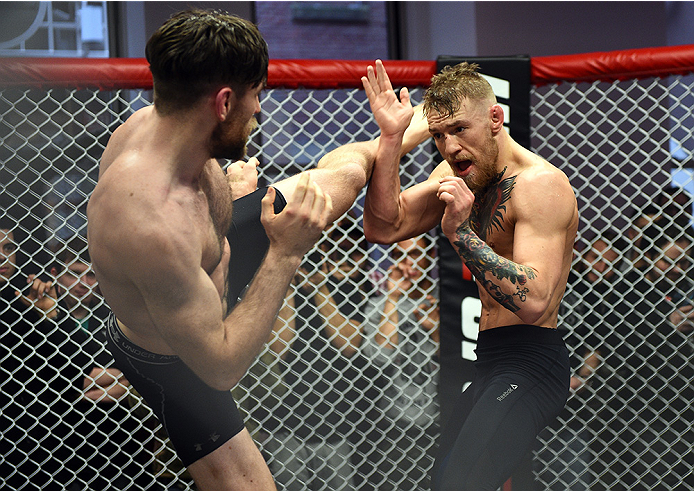 BOSTON, MA - JANUARY 15: UFC featherweight Conor McGregor of Ireland (R) holds an open training session for the media and fans at UFC Gym on January 15, 2015 in Boston, Massachusetts. (Photo by Jeff Bottari/Zuffa LLC/Zuffa LLC via Getty Images)
