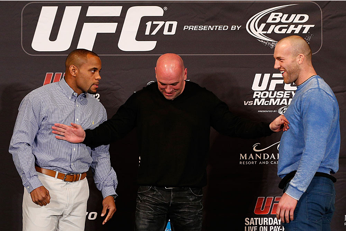 LAS VEGAS, NV - FEBRUARY 20: Opponents Daniel Cormier (L) and Patrick Cummins (R) are separated by UFC President Dana White after a heated exchange during the final UFC 170 pre-fight press conference at the Mandalay Bay Resort and Casino on February 20,