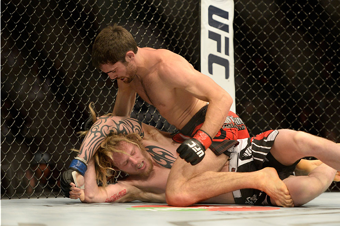 VANCOUVER, BC - JUNE 14: (R-L) Jason Saggo punches Josh Shockley during the UFC 174 event at Rogers Arena on June 14, 2014 in Vancouver, British Columbia, Canada. (Photo by Jeff Bottari/Zuffa LLC/Zuffa LLC via Getty Images)