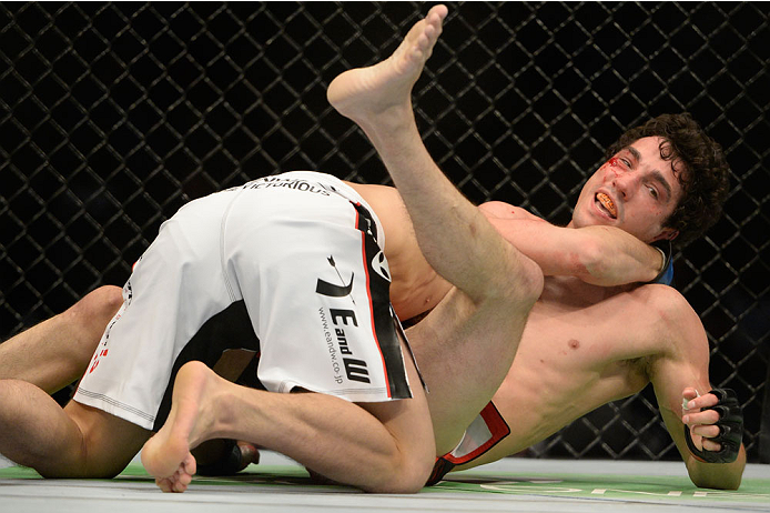 VANCOUVER, BC - JUNE 14: (L-R) Michinori Tanaka controls the body of Roland Delorme during the UFC 174 event at Rogers Arena on June 14, 2014 in Vancouver, British Columbia, Canada. (Photo by Jeff Bottari/Zuffa LLC/Zuffa LLC via Getty Images)