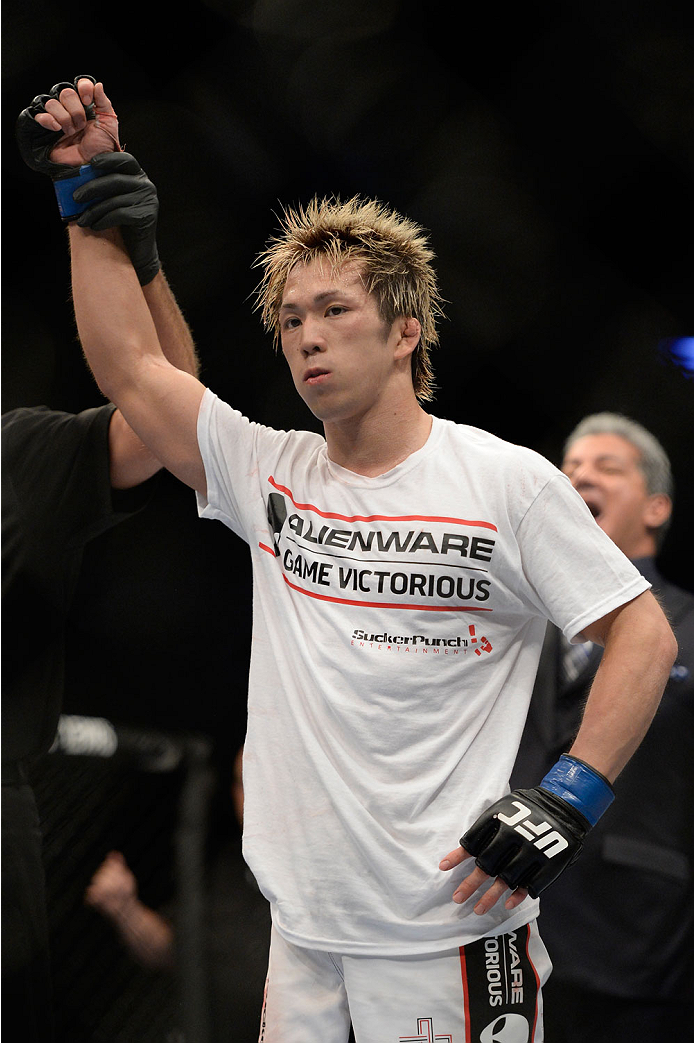 VANCOUVER, BC - JUNE 14: Michinori Tanaka celebrates after defeating Roland Delorme during the UFC 174 event at Rogers Arena on June 14, 2014 in Vancouver, British Columbia, Canada. (Photo by Jeff Bottari/Zuffa LLC/Zuffa LLC via Getty Images)