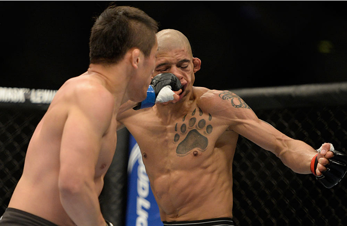 VANCOUVER, BC - JUNE 14: (L-R) Tae Hyun Bang punches Kajan Johnson during the UFC 174 event at Rogers Arena on June 14, 2014 in Vancouver, British Columbia, Canada. (Photo by Jeff Bottari/Zuffa LLC/Zuffa LLC via Getty Images)