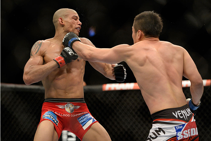VANCOUVER, BC - JUNE 14: (R-L) Tae Hyun Bang punches Kajan Johnson during the UFC 174 event at Rogers Arena on June 14, 2014 in Vancouver, British Columbia, Canada. (Photo by Jeff Bottari/Zuffa LLC/Zuffa LLC via Getty Images)