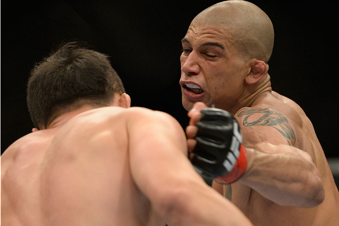 VANCOUVER, BC - JUNE 14: (R-L) Kajan Johnson punches Tae Hyun Bang during the UFC 174 event at Rogers Arena on June 14, 2014 in Vancouver, British Columbia, Canada. (Photo by Jeff Bottari/Zuffa LLC/Zuffa LLC via Getty Images)