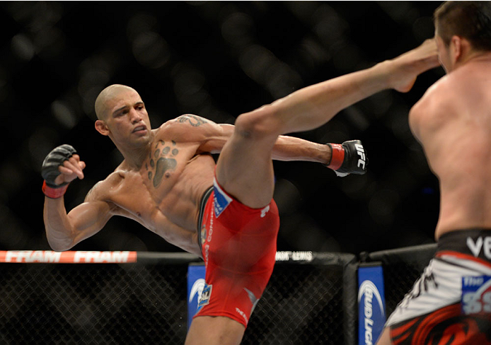 VANCOUVER, BC - JUNE 14: (L-R) Kajan Johnson kicks Tae Hyun Bang during the UFC 174 event at Rogers Arena on June 14, 2014 in Vancouver, British Columbia, Canada. (Photo by Jeff Bottari/Zuffa LLC/Zuffa LLC via Getty Images)