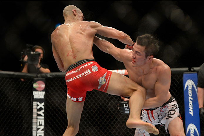 VANCOUVER, BC - JUNE 14: (R-L) Tae Hyun Bang punches Kajan Johnson during the UFC 174 event at Rogers Arena on June 14, 2014 in Vancouver, British Columbia, Canada. (Photo by Jeff Bottari/Zuffa LLC/Zuffa LLC via Getty Images)