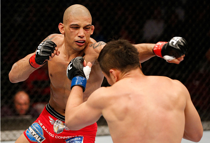 VANCOUVER, BC - JUNE 14: (L-R) Kajan Johnson punches Tae Hyun Bang in their lightweight bout at Rogers Arena on June 14, 2014 in Vancouver, Canada. (Photo by Josh Hedges/Zuffa LLC/Zuffa LLC via Getty Images)