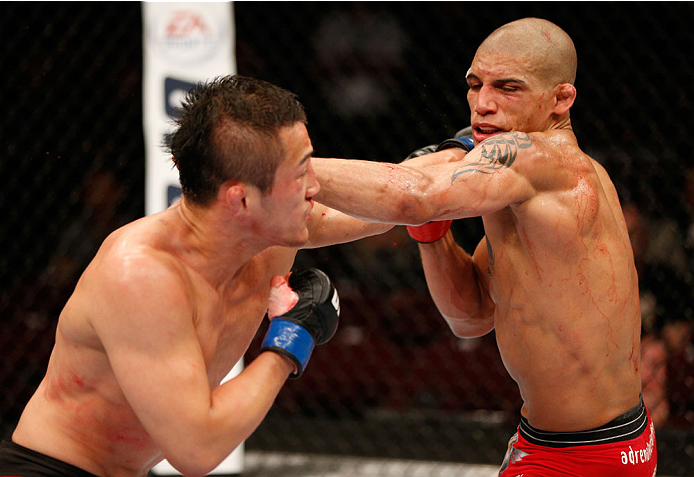 VANCOUVER, BC - JUNE 14: (L-R) Tae Hyun Bang punches Kajan Johnson in their lightweight bout at Rogers Arena on June 14, 2014 in Vancouver, Canada. (Photo by Josh Hedges/Zuffa LLC/Zuffa LLC via Getty Images)