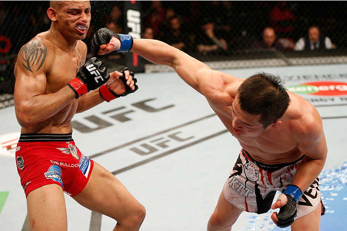 VANCOUVER, BC - JUNE 14: (R-L) Tae Hyun Bang punches Kajan Johnson in their lightweight bout at Rogers Arena on June 14, 2014 in Vancouver, Canada. (Photo by Josh Hedges/Zuffa LLC/Zuffa LLC via Getty Images)