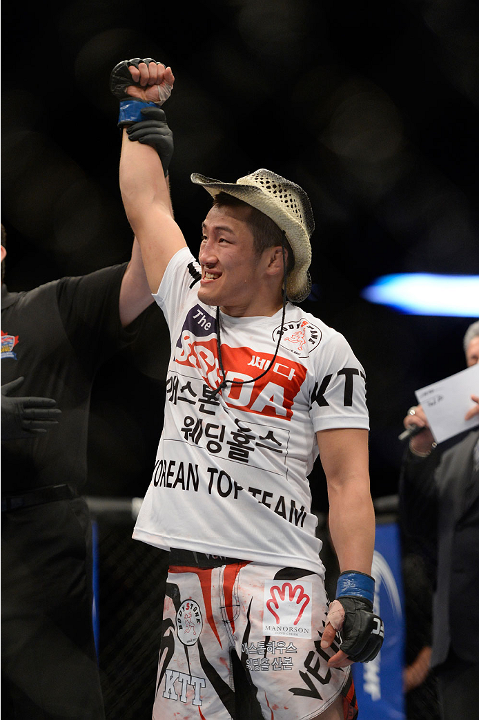VANCOUVER, BC - JUNE 14: Tae Hyun Bang celebrates after defeating Kajan Johnson by KO during the UFC 174 event at Rogers Arena on June 14, 2014 in Vancouver, British Columbia, Canada. (Photo by Jeff Bottari/Zuffa LLC/Zuffa LLC via Getty Images)