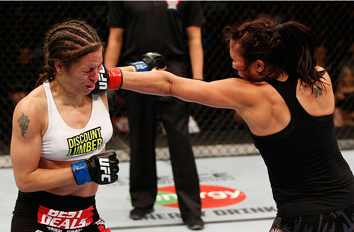 VANCOUVER, BC - JUNE 14: (R-L) Valerie Letourneau punches Elizabeth Phillips in their womens bantamweight bout at Rogers Arena on June 14, 2014 in Vancouver, Canada. (Photo by Josh Hedges/Zuffa LLC/Zuffa LLC via Getty Images)