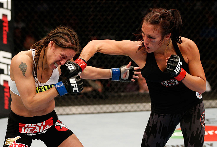 VANCOUVER, BC - JUNE 14: (R-L) Valerie Letourneau punches Elizabeth Phillips in their womens bantamweight bout at Rogers Arena on June 14, 2014 in Vancouver, Canada. (Photo by Josh Hedges/Zuffa LLC/Zuffa LLC via Getty Images)