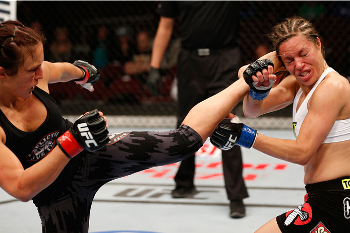 VANCOUVER, BC - JUNE 14: (L-R) Valerie Letourneau kicks Elizabeth Phillips in their womens bantamweight bout at Rogers Arena on June 14, 2014 in Vancouver, Canada. (Photo by Josh Hedges/Zuffa LLC/Zuffa LLC via Getty Images)