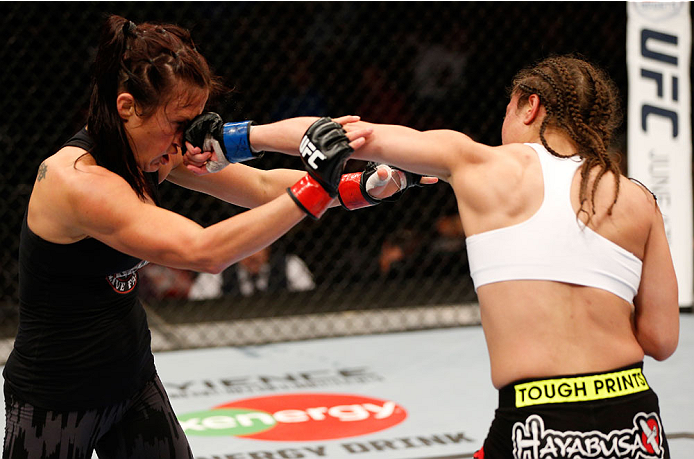 VANCOUVER, BC - JUNE 14: (R-L) Elizabeth Phillips punches Valerie Letourneau in their womens bantamweight bout at Rogers Arena on June 14, 2014 in Vancouver, Canada. (Photo by Josh Hedges/Zuffa LLC/Zuffa LLC via Getty Images)