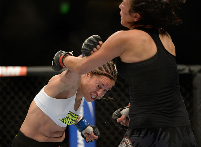 VANCOUVER, BC - JUNE 14: (L-R) Elizabeth Phillips punches Valerie Latourneau during the UFC 174 event at Rogers Arena on June 14, 2014 in Vancouver, British Columbia, Canada. (Photo by Jeff Bottari/Zuffa LLC/Zuffa LLC via Getty Images)