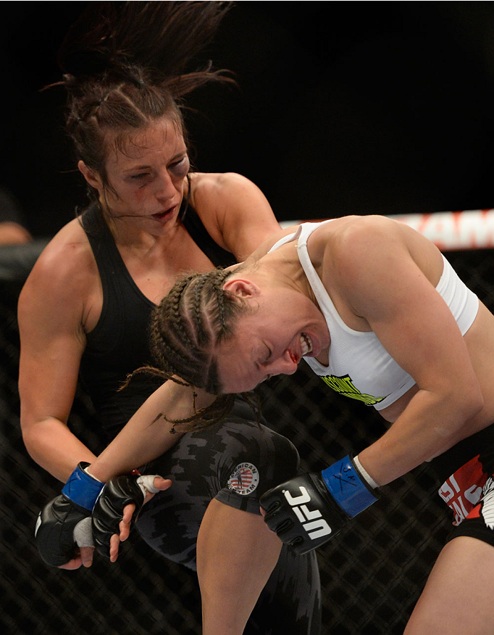 VANCOUVER, BC - JUNE 14: (L-R) Valerie Latourneau knees the head of Elizabeth Phillips during the UFC 174 event at Rogers Arena on June 14, 2014 in Vancouver, British Columbia, Canada. (Photo by Jeff Bottari/Zuffa LLC/Zuffa LLC via Getty Images)