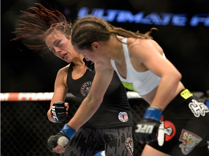VANCOUVER, BC - JUNE 14: (R-L) Elizabeth Phillips punches Valerie Latourneau during the UFC 174 event at Rogers Arena on June 14, 2014 in Vancouver, British Columbia, Canada. (Photo by Jeff Bottari/Zuffa LLC/Zuffa LLC via Getty Images)