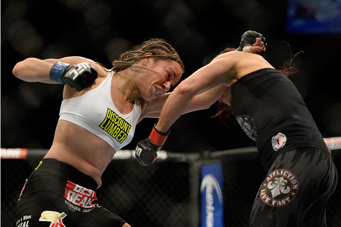 VANCOUVER, BC - JUNE 14: (L-R) Elizabeth Phillips punches Valerie Latourneau during the UFC 174 event at Rogers Arena on June 14, 2014 in Vancouver, British Columbia, Canada. (Photo by Jeff Bottari/Zuffa LLC/Zuffa LLC via Getty Images)