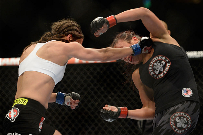 VANCOUVER, BC - JUNE 14: (L-R) Elizabeth Phillips punches Valerie Latourneau during the UFC 174 event at Rogers Arena on June 14, 2014 in Vancouver, British Columbia, Canada. (Photo by Jeff Bottari/Zuffa LLC/Zuffa LLC via Getty Images)