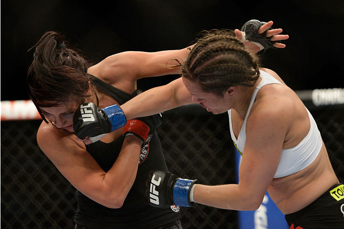 VANCOUVER, BC - JUNE 14: (R-L) Elizabeth Phillips punches Valerie Latourneau during the UFC 174 event at Rogers Arena on June 14, 2014 in Vancouver, British Columbia, Canada. (Photo by Jeff Bottari/Zuffa LLC/Zuffa LLC via Getty Images)