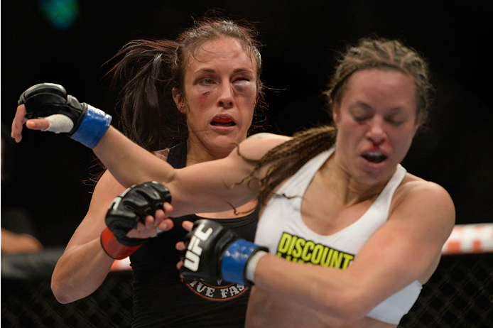 VANCOUVER, BC - JUNE 14: (L-R) Valerie Latourneau punches Elizabeth Phillips during the UFC 174 event at Rogers Arena on June 14, 2014 in Vancouver, British Columbia, Canada. (Photo by Jeff Bottari/Zuffa LLC/Zuffa LLC via Getty Images)