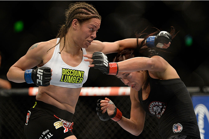 VANCOUVER, BC - JUNE 14: (L-R) Elizabeth Phillips punches Valerie Latourneau during the UFC 174 event at Rogers Arena on June 14, 2014 in Vancouver, British Columbia, Canada. (Photo by Jeff Bottari/Zuffa LLC/Zuffa LLC via Getty Images)
