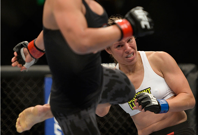 VANCOUVER, BC - JUNE 14: (L-R) Valerie Latourneau kicks Elizabeth Phillips during the UFC 174 event at Rogers Arena on June 14, 2014 in Vancouver, British Columbia, Canada. (Photo by Jeff Bottari/Zuffa LLC/Zuffa LLC via Getty Images)