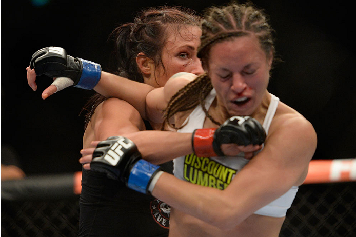 VANCOUVER, BC - JUNE 14: (L-R) Valerie Latourneau punches Elizabeth Phillips during the UFC 174 event at Rogers Arena on June 14, 2014 in Vancouver, British Columbia, Canada. (Photo by Jeff Bottari/Zuffa LLC/Zuffa LLC via Getty Images)