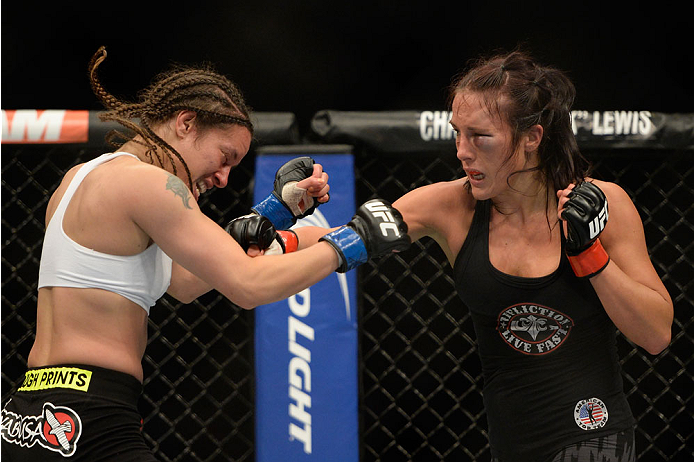 VANCOUVER, BC - JUNE 14: (R-L) Valerie Latourneau punches Elizabeth Phillips during the UFC 174 event at Rogers Arena on June 14, 2014 in Vancouver, British Columbia, Canada. (Photo by Jeff Bottari/Zuffa LLC/Zuffa LLC via Getty Images)