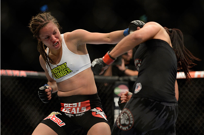 VANCOUVER, BC - JUNE 14: (L-R) Elizabeth Phillips punches Valerie Latourneau during the UFC 174 event at Rogers Arena on June 14, 2014 in Vancouver, British Columbia, Canada. (Photo by Jeff Bottari/Zuffa LLC/Zuffa LLC via Getty Images)