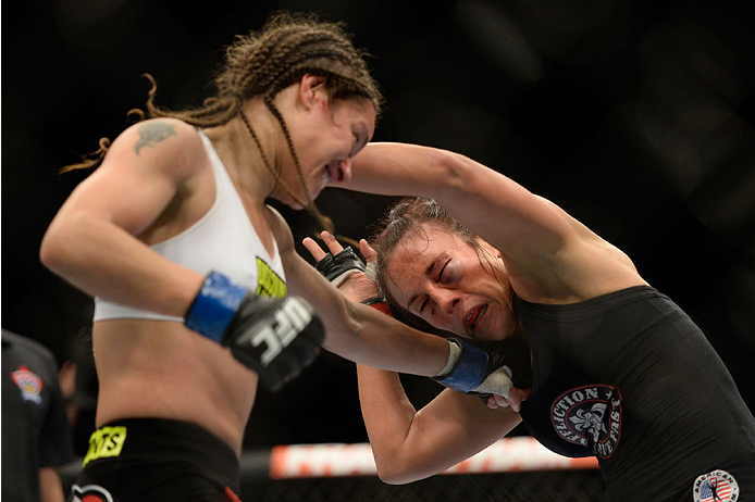 VANCOUVER, BC - JUNE 14: (L-R) Elizabeth Phillips punches Valerie Latourneau during the UFC 174 event at Rogers Arena on June 14, 2014 in Vancouver, British Columbia, Canada. (Photo by Jeff Bottari/Zuffa LLC/Zuffa LLC via Getty Images)