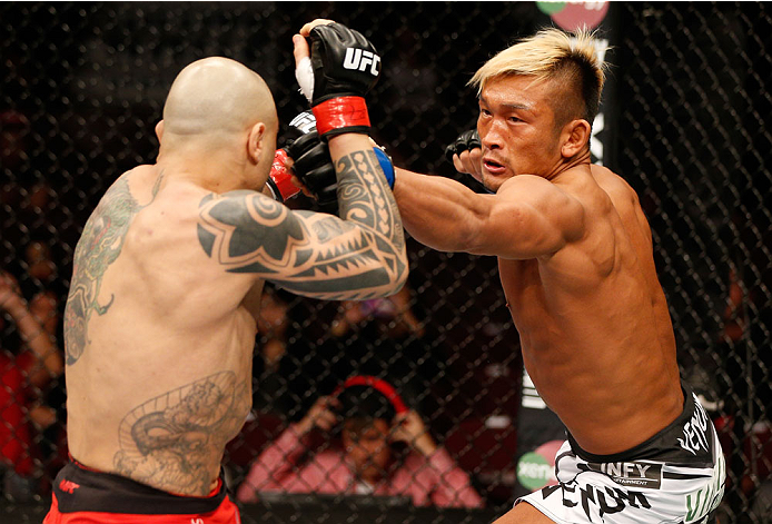 VANCOUVER, BC - JUNE 14: (R-L) Kiichi Kunimoto punches Daniel Sarafian in their welterweight bout at Rogers Arena on June 14, 2014 in Vancouver, Canada. (Photo by Josh Hedges/Zuffa LLC/Zuffa LLC via Getty Images)