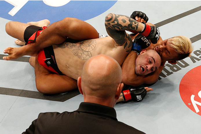 VANCOUVER, BC - JUNE 14: (R-L) Kiichi Kunimoto secures a rear choke submission against Daniel Sarafian in their welterweight bout at Rogers Arena on June 14, 2014 in Vancouver, Canada. (Photo by Josh Hedges/Zuffa LLC/Zuffa LLC via Getty Images)