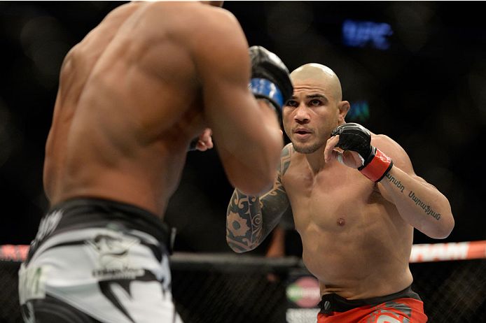 VANCOUVER, BC - JUNE 14: (R-L) Daniel Sarafian looks to strike Kiichi Kunimoto during the UFC 174 event at Rogers Arena on June 14, 2014 in Vancouver, British Columbia, Canada. (Photo by Jeff Bottari/Zuffa LLC/Zuffa LLC via Getty Images)