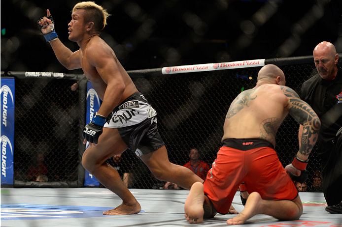 VANCOUVER, BC - JUNE 14: (L-R) Kiichi Kunimoto celebrates after defeating Daniel Sarafian by a rear naked choke during the UFC 174 event at Rogers Arena on June 14, 2014 in Vancouver, British Columbia, Canada. (Photo by Jeff Bottari/Zuffa LLC/Zuffa LLC v