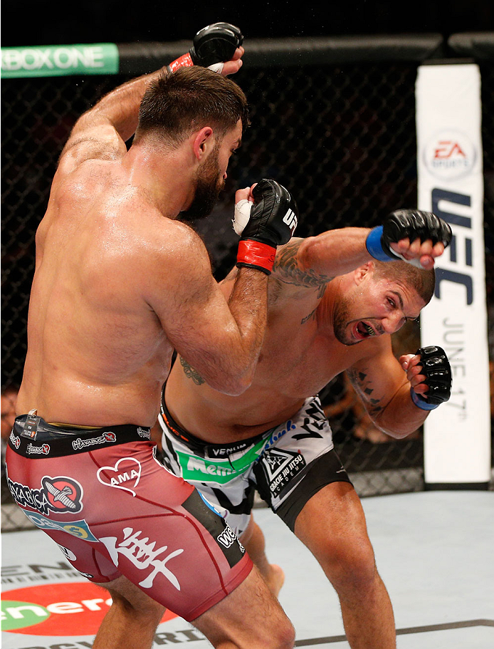 VANCOUVER, BC - JUNE 14: (R-L) Brendan Schaub follows through on an punch against Andrei Arlovski in their heavyweight bout at Rogers Arena on June 14, 2014 in Vancouver, Canada. (Photo by Josh Hedges/Zuffa LLC/Zuffa LLC via Getty Images)