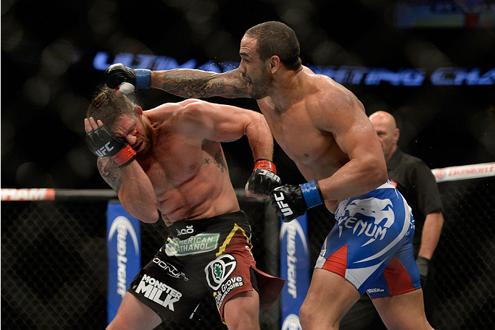 VANCOUVER, BC - JUNE 14: (R-L) Rafael Cavalcante punches Ryan Bader during the UFC 174 event at Rogers Arena on June 14, 2014 in Vancouver, British Columbia, Canada. (Photo by Jeff Bottari/Zuffa LLC/Zuffa LLC via Getty Images)