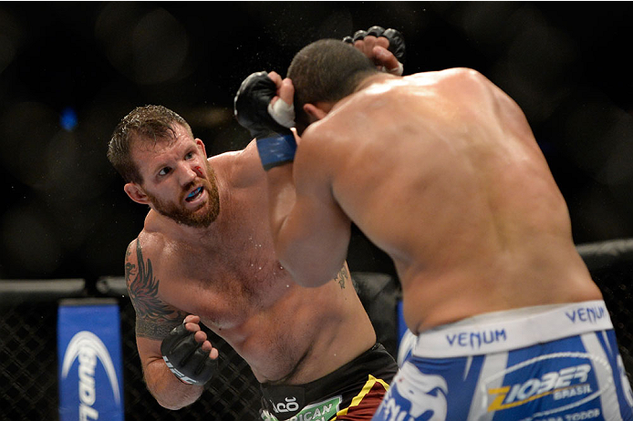 VANCOUVER, BC - JUNE 14: (L-R) Ryan Bader punches Rafael Cavalcante during the UFC 174 event at Rogers Arena on June 14, 2014 in Vancouver, British Columbia, Canada. (Photo by Jeff Bottari/Zuffa LLC/Zuffa LLC via Getty Images)