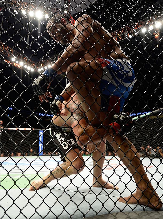 VANCOUVER, BC - JUNE 14: (L-R) Ryan Bader attempts a takedown on Rafael Cavalcante during the UFC 174 event at Rogers Arena on June 14, 2014 in Vancouver, British Columbia, Canada. (Photo by Jeff Bottari/Zuffa LLC/Zuffa LLC via Getty Images)