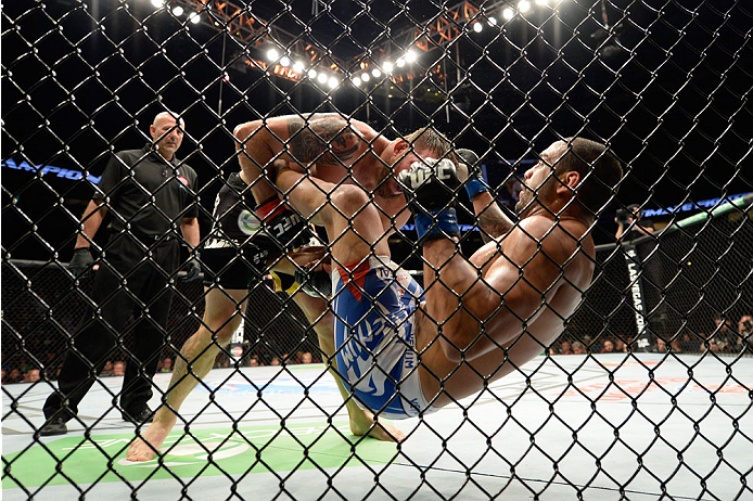 VANCOUVER, BC - JUNE 14: (L-R) Ryan Bader takes down Rafael Cavalcante during the UFC 174 event at Rogers Arena on June 14, 2014 in Vancouver, British Columbia, Canada. (Photo by Jeff Bottari/Zuffa LLC/Zuffa LLC via Getty Images)