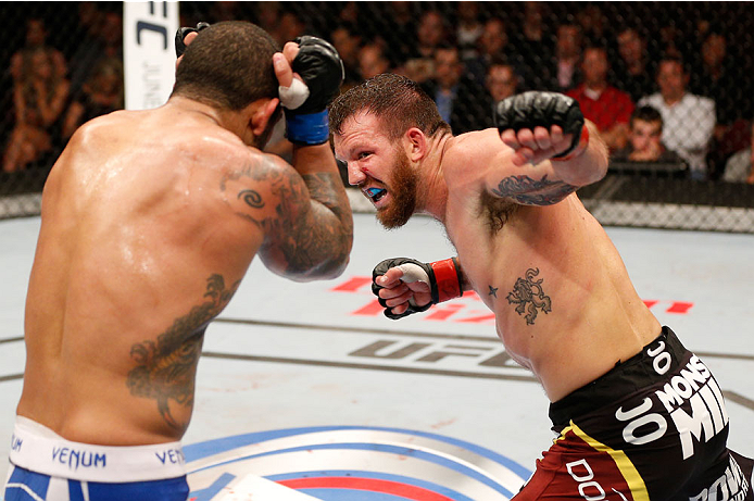 VANCOUVER, BC - JUNE 14: (R-L) Ryan Bader punches Rafael "Feijao" Cavalcante in their light heavyweight bout at Rogers Arena on June 14, 2014 in Vancouver, Canada. (Photo by Josh Hedges/Zuffa LLC/Zuffa LLC via Getty Images)
