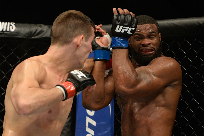 VANCOUVER, BC - JUNE 14: (L-R) Rory MacDonald punches Tyron Woodley during the UFC 174 event at Rogers Arena on June 14, 2014 in Vancouver, British Columbia, Canada. (Photo by Jeff Bottari/Zuffa LLC/Zuffa LLC via Getty Images)