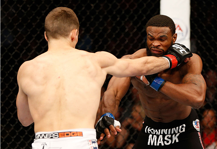 VANCOUVER, BC - JUNE 14: (L-R) Rory MacDonald punches Tyron Woodley in their welterweight bout at Rogers Arena on June 14, 2014 in Vancouver, Canada. (Photo by Josh Hedges/Zuffa LLC/Zuffa LLC via Getty Images)