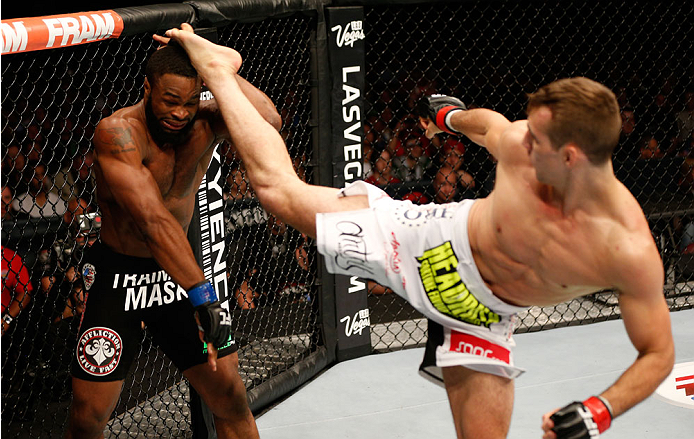 VANCOUVER, BC - JUNE 14: (R-L) Rory MacDonald kicks Tyron Woodley in their welterweight bout at Rogers Arena on June 14, 2014 in Vancouver, Canada. (Photo by Josh Hedges/Zuffa LLC/Zuffa LLC via Getty Images)
