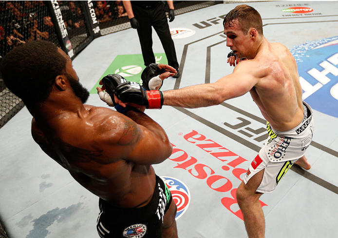 VANCOUVER, BC - JUNE 14: (R-L) Rory MacDonald punches Tyron Woodley in their welterweight bout at Rogers Arena on June 14, 2014 in Vancouver, Canada. (Photo by Josh Hedges/Zuffa LLC/Zuffa LLC via Getty Images)