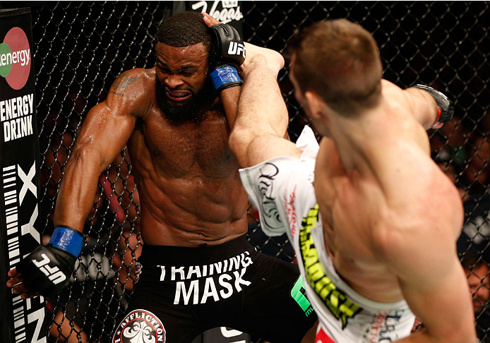 VANCOUVER, BC - JUNE 14: (R-L) Rory MacDonald kicks Tyron Woodley in their welterweight bout at Rogers Arena on June 14, 2014 in Vancouver, Canada. (Photo by Josh Hedges/Zuffa LLC/Zuffa LLC via Getty Images)