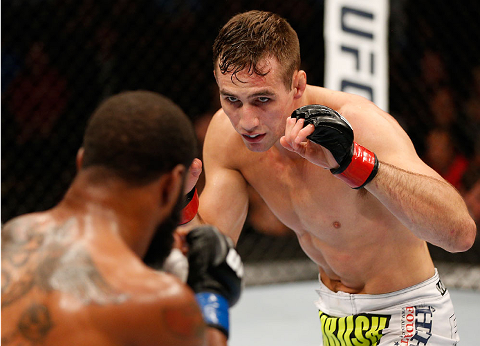 VANCOUVER, BC - JUNE 14: (R-L) Rory MacDonald battles Tyron Woodley in their welterweight bout at Rogers Arena on June 14, 2014 in Vancouver, Canada. (Photo by Josh Hedges/Zuffa LLC/Zuffa LLC via Getty Images)