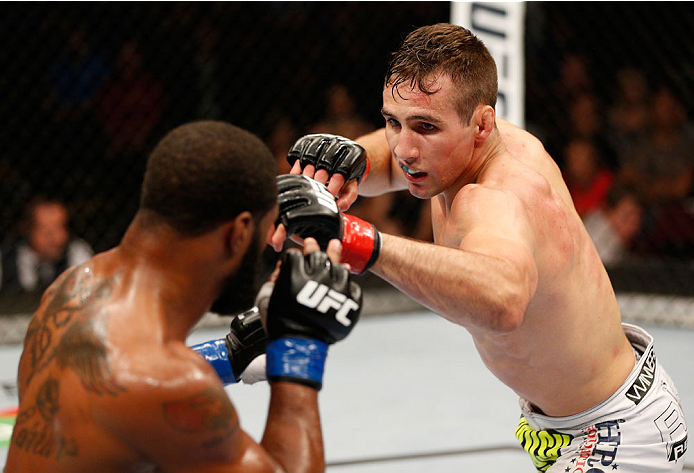 VANCOUVER, BC - JUNE 14: (R-L) Rory MacDonald battles Tyron Woodley in their welterweight bout at Rogers Arena on June 14, 2014 in Vancouver, Canada. (Photo by Josh Hedges/Zuffa LLC/Zuffa LLC via Getty Images)