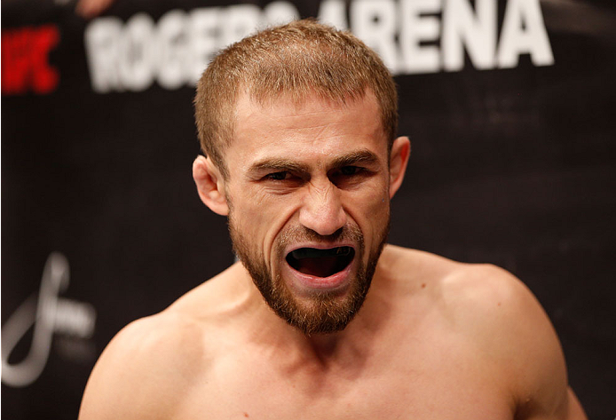 VANCOUVER, BC - JUNE 14: UFC flyweight challenger Ali Bagauitinov enters the Octagon before facing UFC Flyweight Champion Demetrious 'Mighty Mouse' Johnson in their UFC flyweight championship bout at Rogers Arena on June 14, 2014 in Vancouver, Canada. (